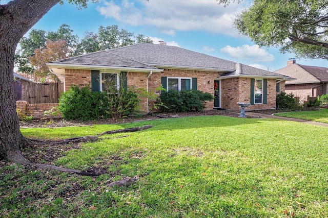 single story home featuring a front yard