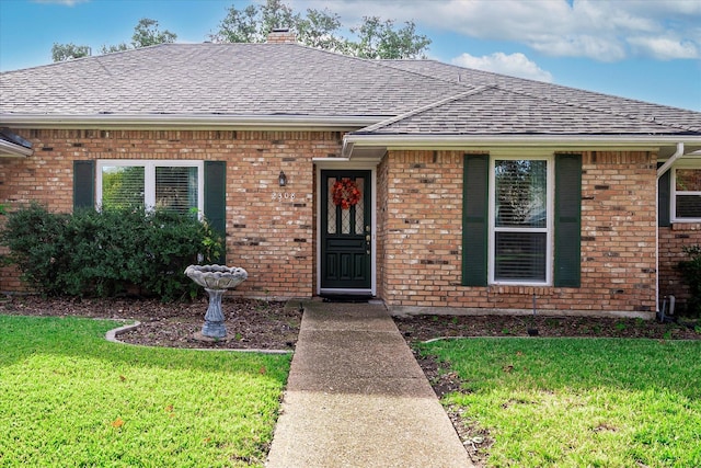 ranch-style home with a front yard