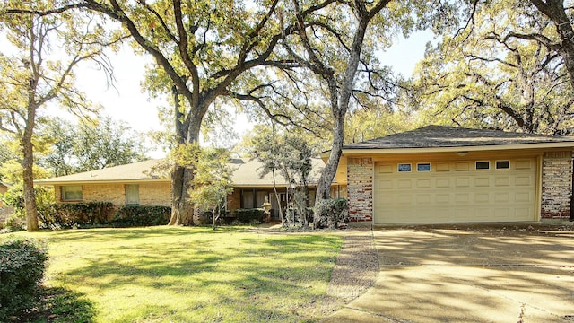 view of front of house with a garage and a front lawn