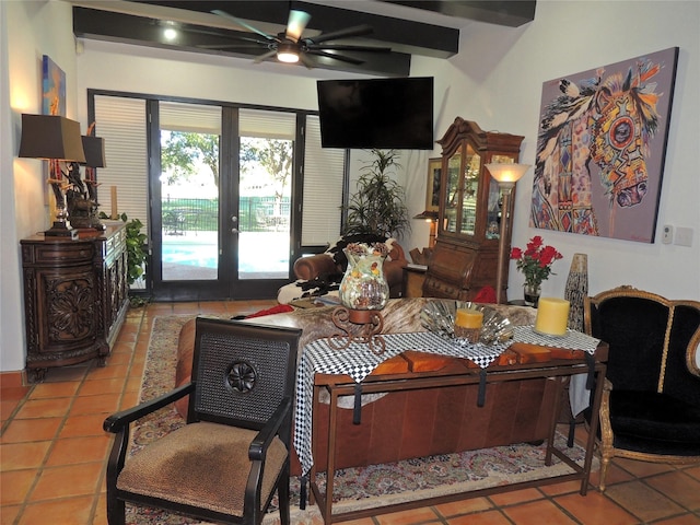 living room with tile patterned floors and ceiling fan