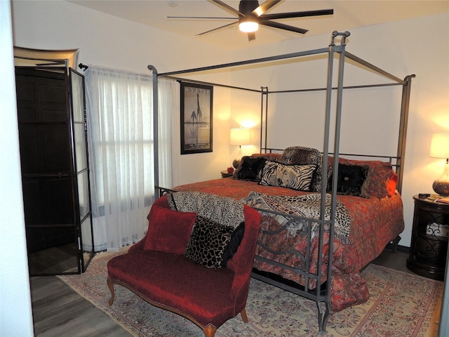 bedroom with ceiling fan and hardwood / wood-style floors