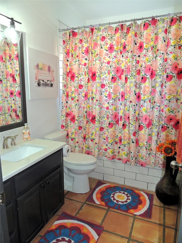 bathroom featuring tile patterned floors, vanity, toilet, and a shower with shower curtain