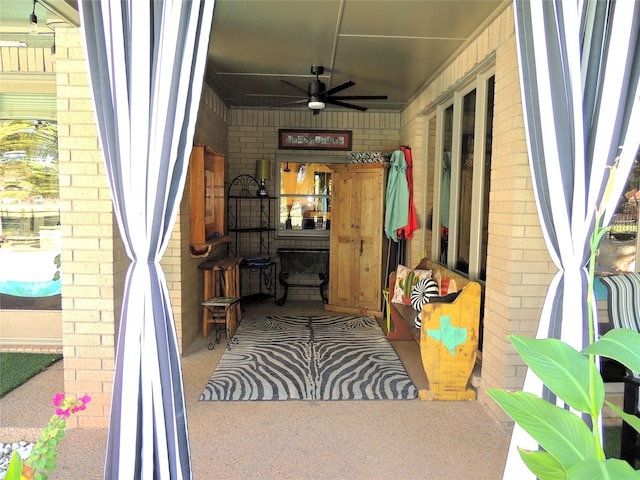 view of patio featuring ceiling fan