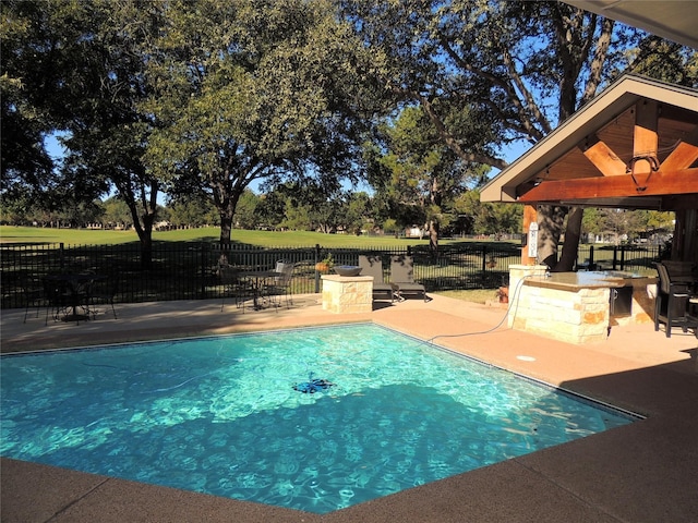 view of pool with a gazebo, exterior bar, and a patio