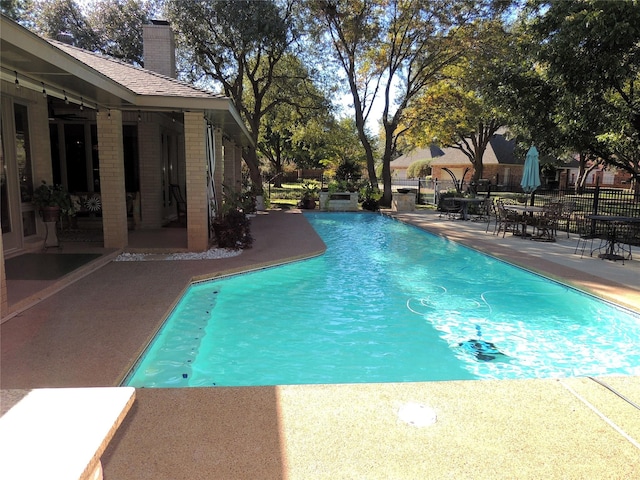 view of pool featuring a patio area