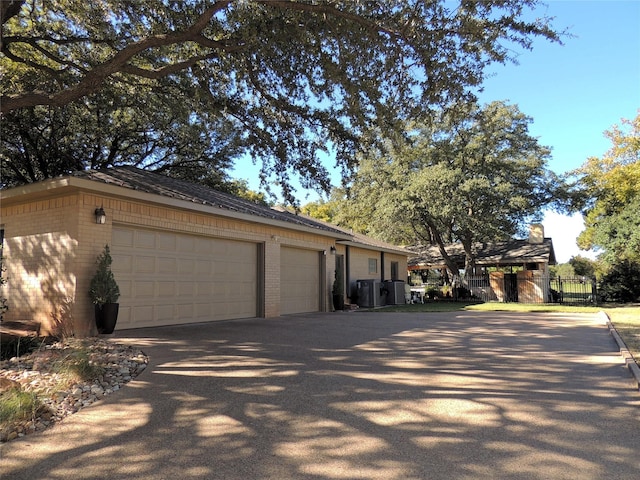 view of property exterior with a garage and an outdoor structure