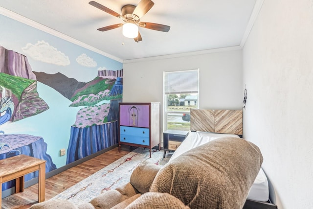 bedroom with hardwood / wood-style floors, ceiling fan, and ornamental molding