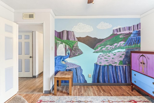 bedroom featuring wood-type flooring, ceiling fan, and ornamental molding