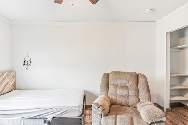 bedroom featuring wood-type flooring, ceiling fan, and crown molding