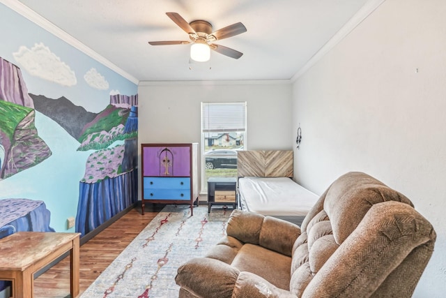 interior space featuring wood-type flooring, ceiling fan, and crown molding