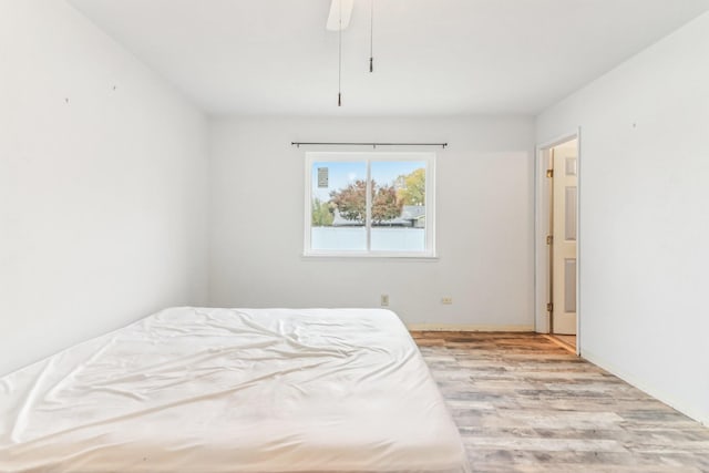 bedroom featuring ceiling fan and light wood-type flooring