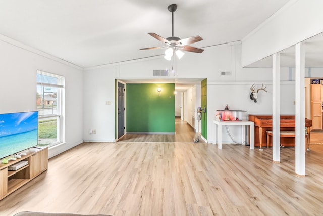 living room with ceiling fan, light hardwood / wood-style floors, lofted ceiling, and ornamental molding