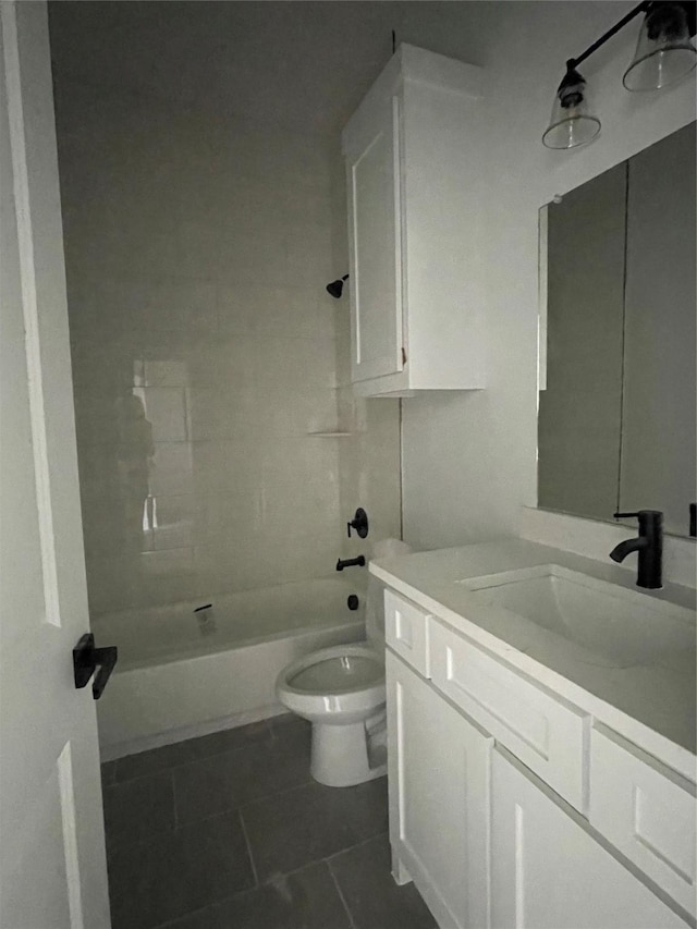 full bathroom with tile patterned flooring, vanity, toilet, and tiled shower / bath