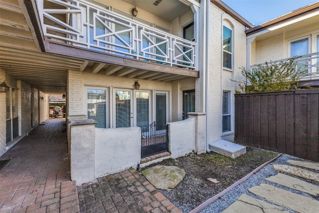 property entrance with a balcony