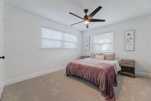 bedroom with ceiling fan and light colored carpet