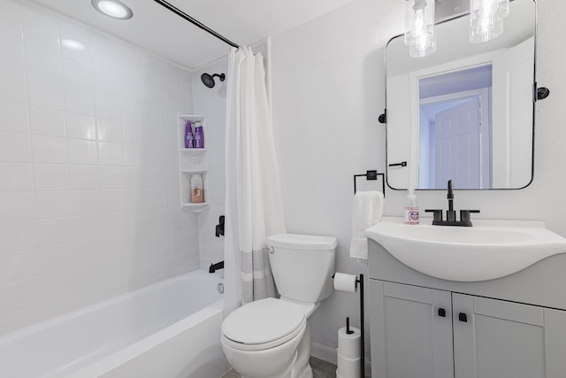 full bathroom with vanity, shower / bath combination with curtain, and toilet