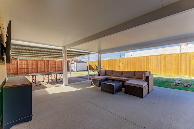 view of patio / terrace with outdoor lounge area and a storage unit