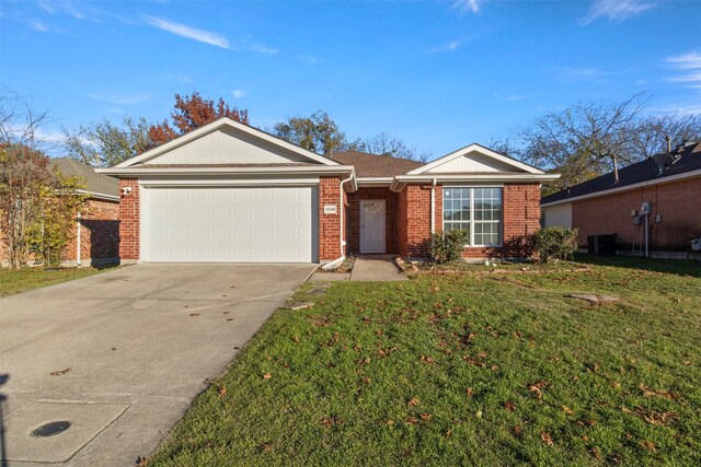 single story home featuring a front lawn, a garage, and central AC