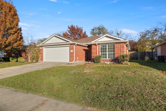 single story home with a garage, a front lawn, and central air condition unit