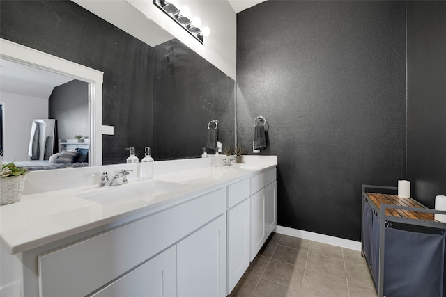 bathroom with tile patterned flooring and vanity