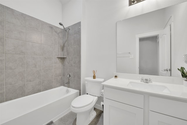 full bathroom with tile patterned flooring, toilet, vanity, and tiled shower / bath