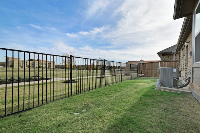 view of yard featuring central air condition unit