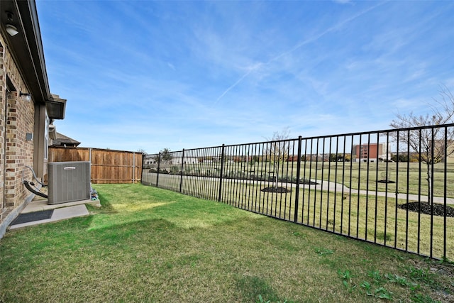 view of yard with central AC