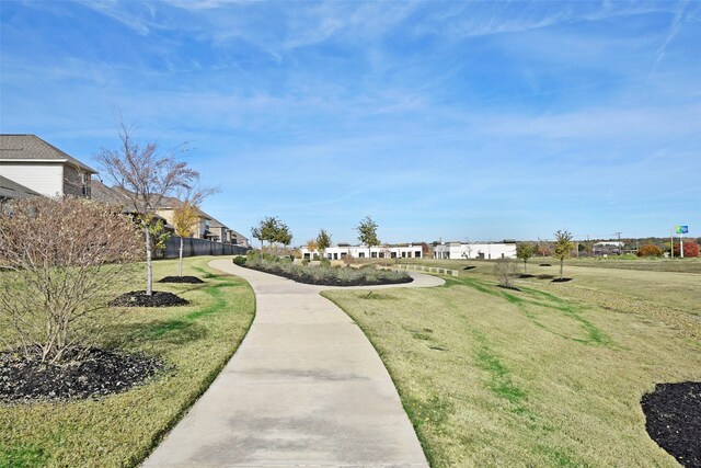 view of home's community featuring a yard