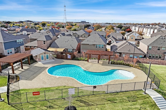 view of swimming pool featuring a pergola and a yard