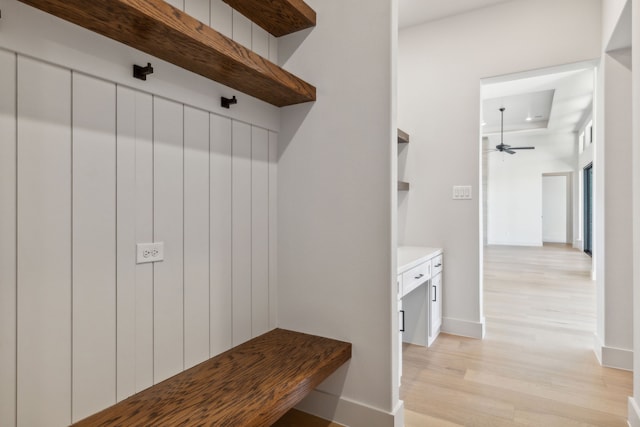 mudroom with light hardwood / wood-style flooring and ceiling fan