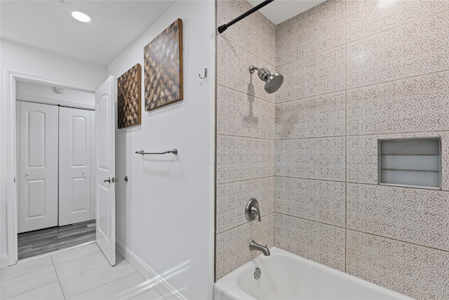 bathroom with tile patterned flooring and tiled shower / bath