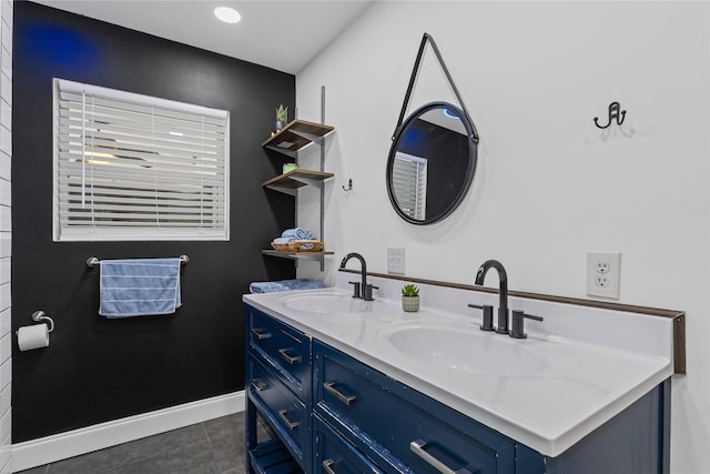 bathroom with tile patterned flooring and vanity