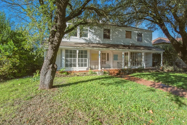 view of front of house featuring a porch and a front yard