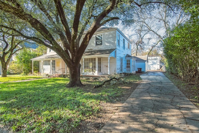 view of front of property with a porch and a front lawn