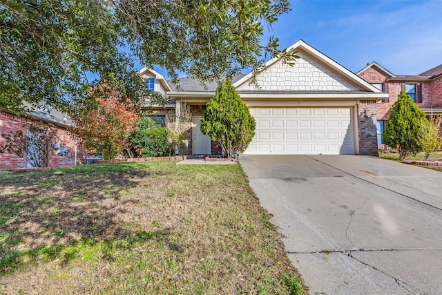 view of front of property featuring a garage, brick siding, concrete driveway, and a front yard