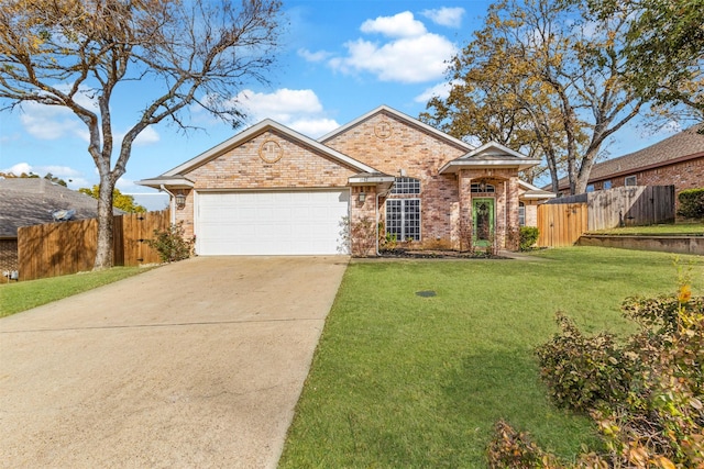 view of front of home with a front yard and a garage