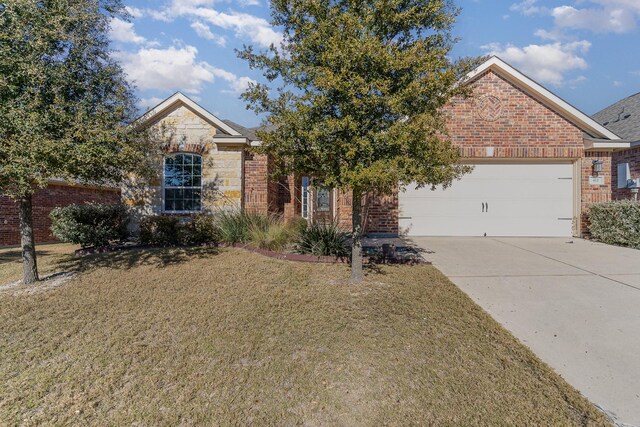 view of front facade with a garage and a front lawn