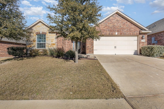 view of front of house featuring a garage and a front lawn