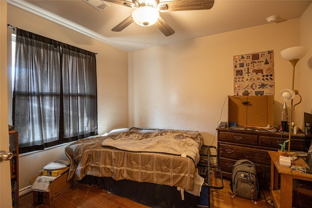 bedroom featuring ceiling fan and hardwood / wood-style flooring