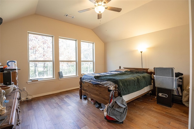 bedroom with hardwood / wood-style floors, ceiling fan, and vaulted ceiling