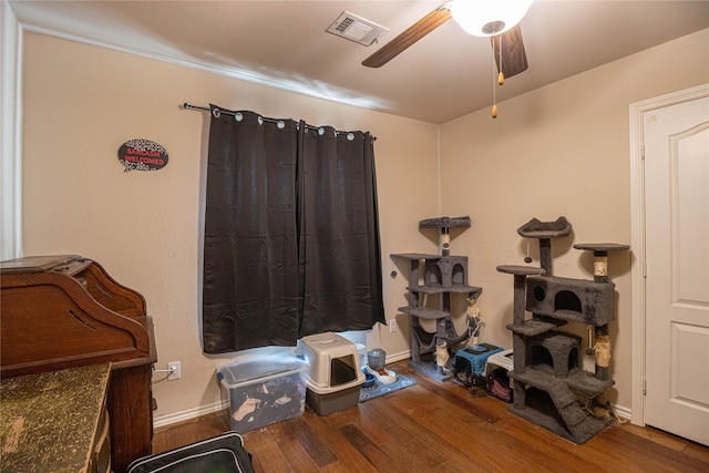 miscellaneous room with ceiling fan and wood-type flooring