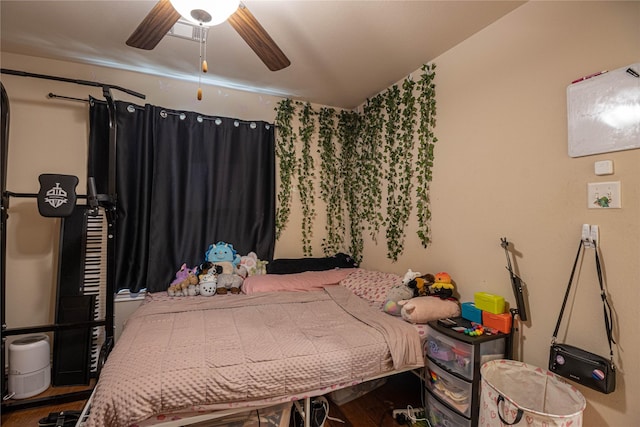 bedroom featuring ceiling fan and hardwood / wood-style floors