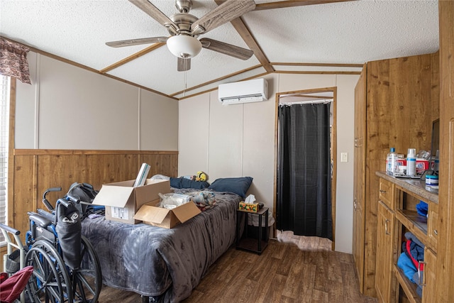 bedroom with ceiling fan, dark hardwood / wood-style flooring, a wall mounted AC, a textured ceiling, and lofted ceiling