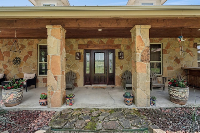 entrance to property featuring a porch