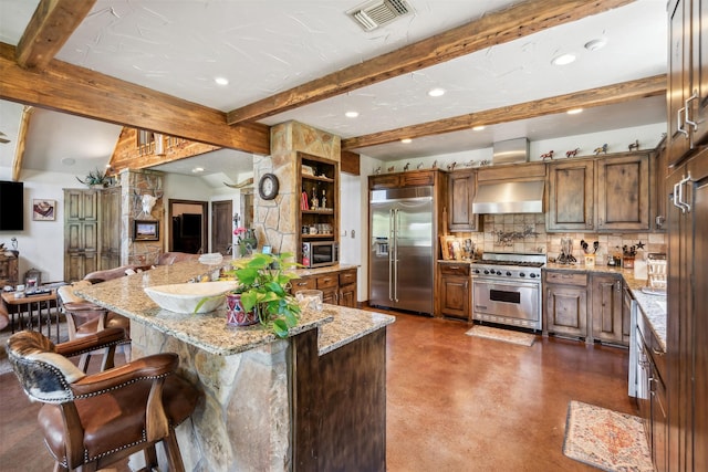 kitchen featuring a center island, high end appliances, exhaust hood, beam ceiling, and light stone counters