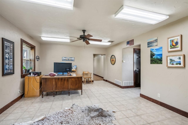 office featuring ceiling fan and light tile patterned floors