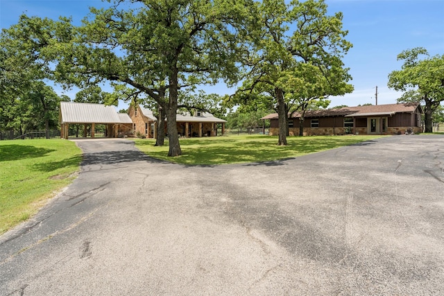 ranch-style home with a front lawn