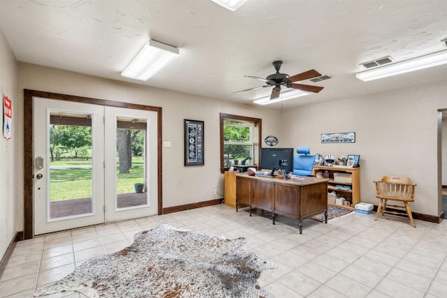 home office with french doors, light tile patterned floors, and ceiling fan