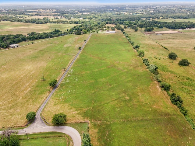 birds eye view of property with a rural view