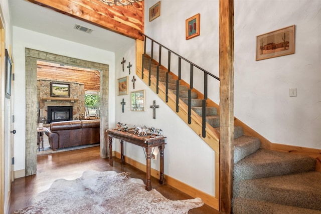 stairs featuring a fireplace